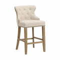 Taburete de madera con tapizado de poliéster beige y tachuelas